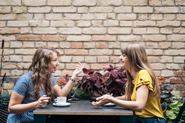 istock Relaxing women enjoying coffee together 1094136962