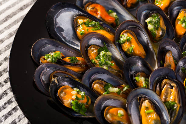 istock Mussels with herbs on plate 1094145196