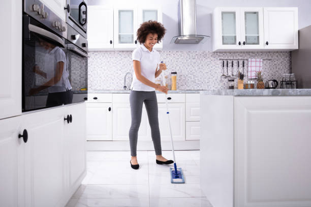 istock Happy Janitor Cleaning Floor With Mop 1094153060