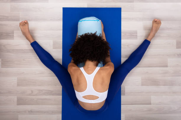 istock Slim Young Woman Exercising At Home 1094154230