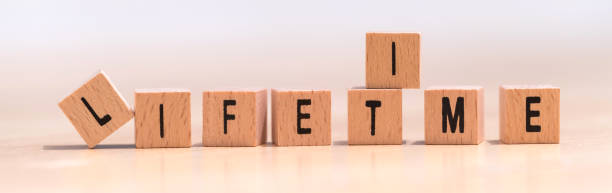 istock wood cubes with the word lifetime on it 1094158154