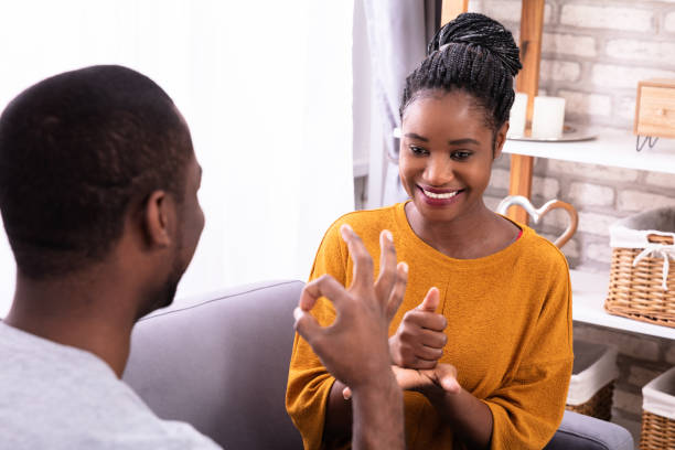 istock Couple Communicating With Sign Languages 1094158156