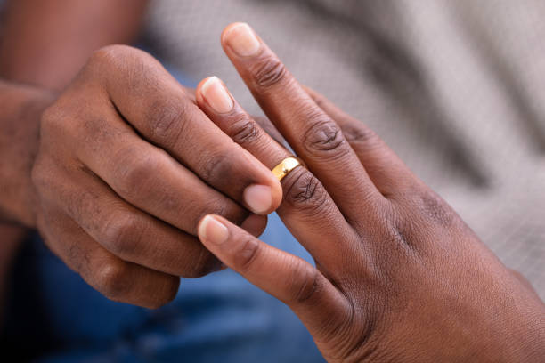 istock Man Putting An Engagement Ring On Woman's Finger 1094158166