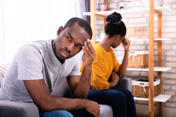 istock Depressed Couple Sitting On Sofa 1094158210
