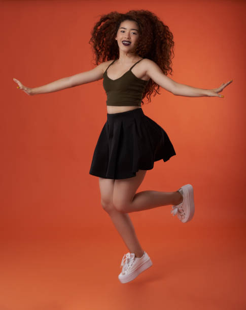 istock Young woman happy jump 1094158560