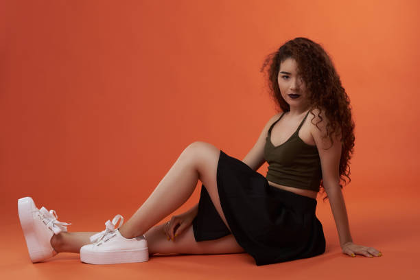 istock Teenager girl sitting on floor 1094158564