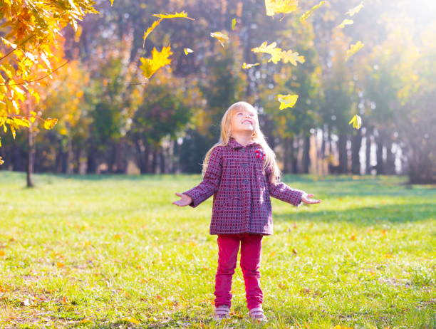 Girl, garden, autumn, falling leaves