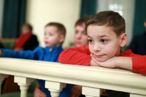 istock Boy in balcony of theater 1094163856