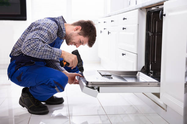 istock Repairman Fixing Dishwasher 1094164078