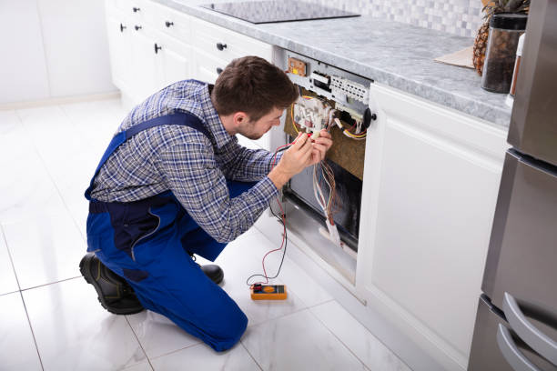 istock Repairman Fixing Dishwasher With Digital Multimeter 1094164092