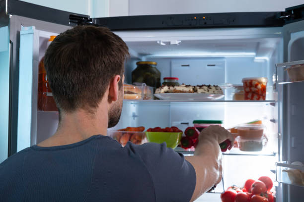 istock Man Taking Food From Refrigerator 1094164688