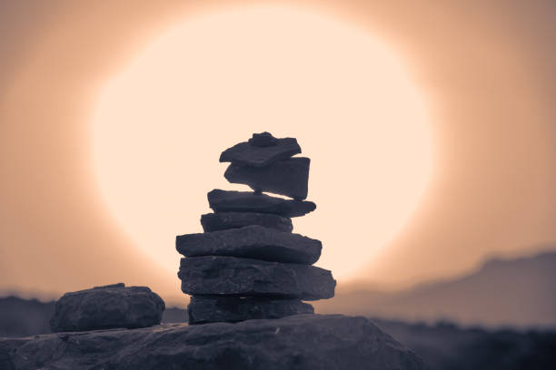 abstract stones composition builded in desert  during  of sunset. Toned.