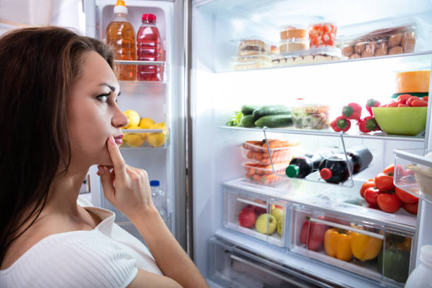 istock Young Woman Looking For Food 1094167130