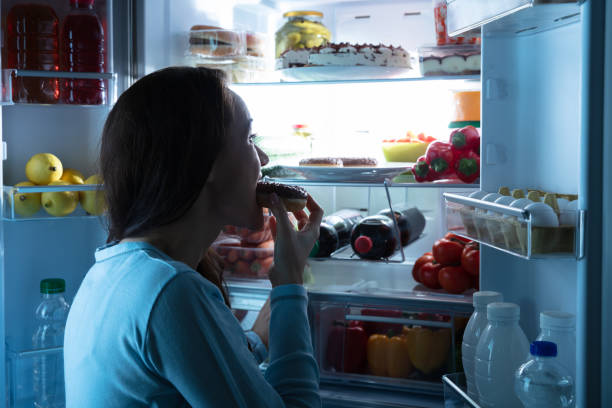 istock Woman Eating Donut 1094167188