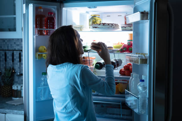 istock Woman Eating Delicious Burger 1094167202
