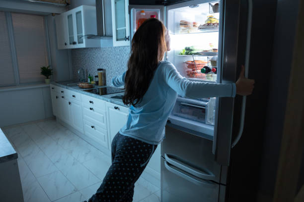 istock Woman Opening Refrigerator Door 1094167214
