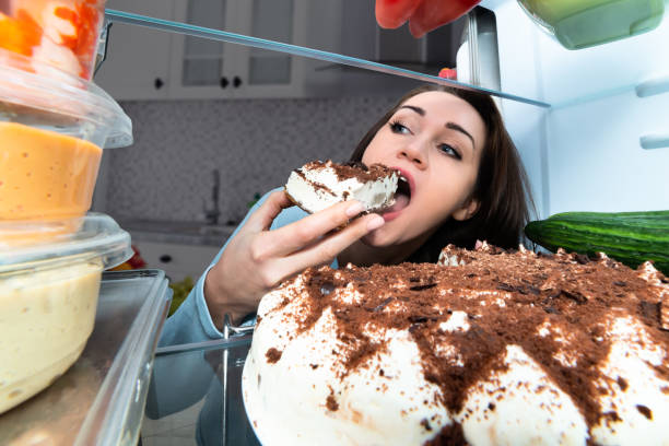 istock Woman Eating Slice Of Cake 1094167228