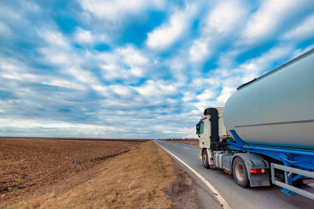 istock Truck on the road through countryside 1094170730