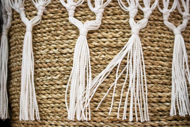 istock Background of woven basket with macrame trim and tassels - selective focus 1094171852