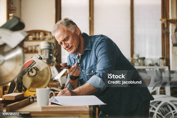 Senior Carpenter Working At His Workshop Stock Photo - Download Image Now - Small Business, Owner, Senior Adult