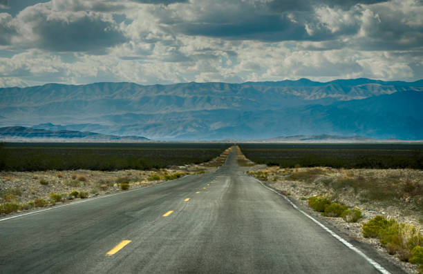 istock A long lonesome road into nowhere desert. 1094187704