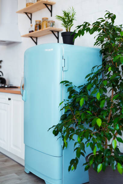 istock Kitchen interior in white textured colors with blue modern retro fridge and rustic brick wall. Vertical still-life photo 1094189948