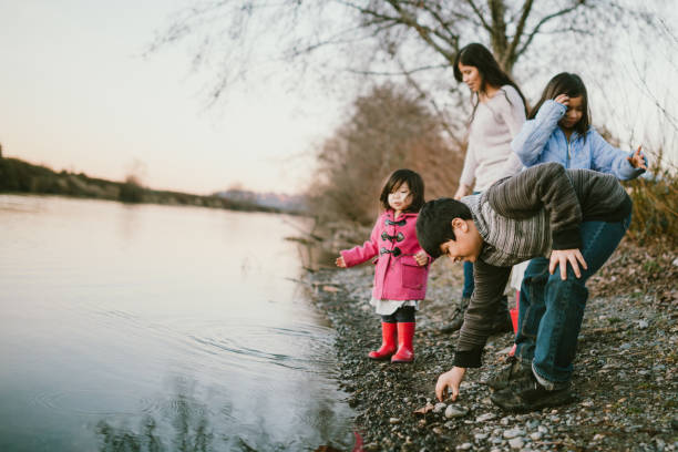 istock Loving Hispanic Family Together At River Waterfront 1094194562