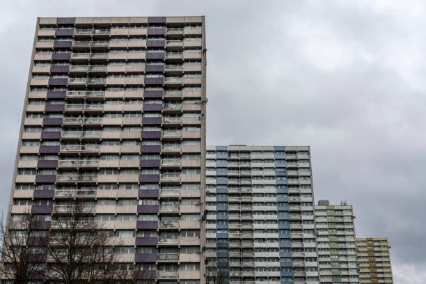 Tower Blocks in London Council Estate Perspective of 4 (now-demolished) tower blocks in a council estate in Enfield, North London. run down neighborhood stock pictures, royalty-free photos & images