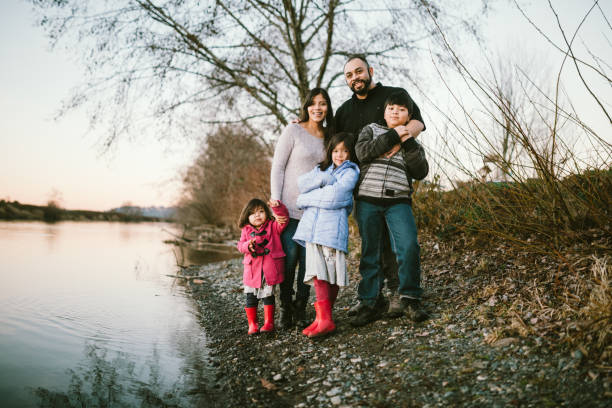 istock Loving Hispanic Family Together At River Waterfront 1094194858