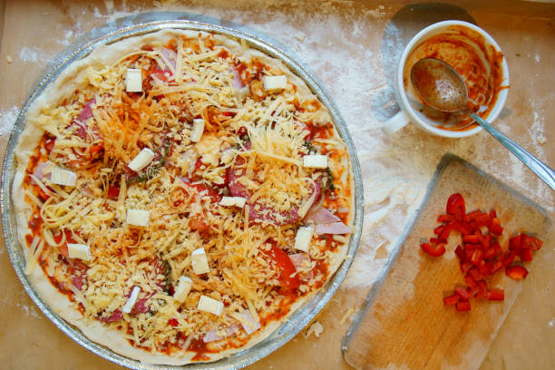 pizza with ham and cheese - pizza sauces chef making imagens e fotografias de stock