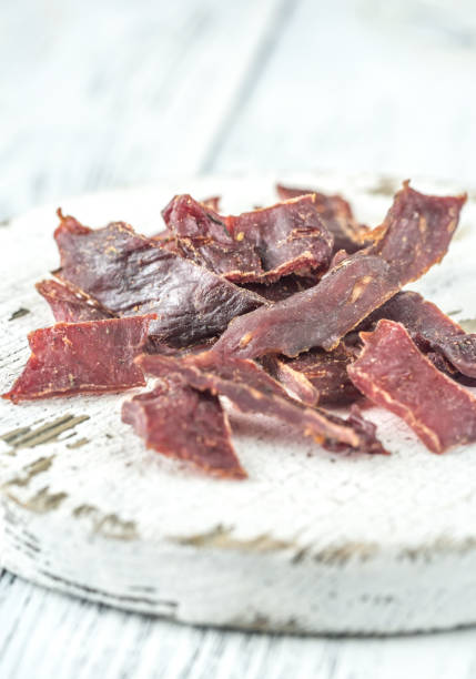 istock Beef jerky on the white wooden board 1094196202