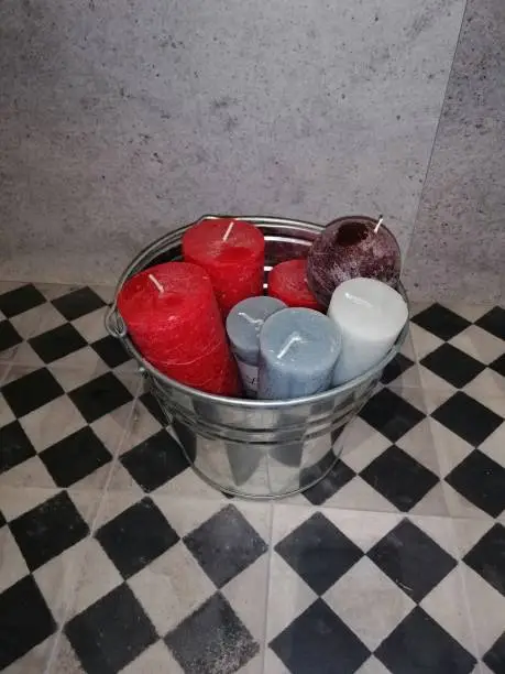 wax candles in a bucket
