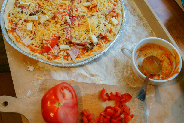 pizza with ham and cheese - pizza sauces chef making imagens e fotografias de stock