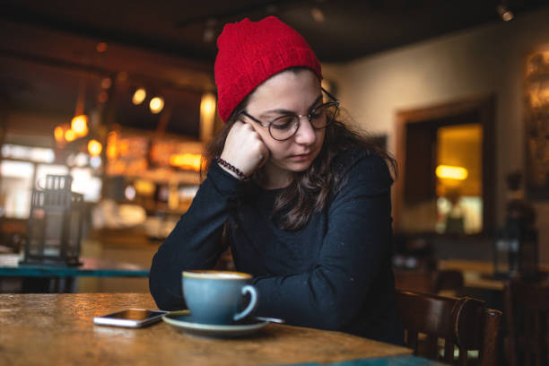 istock Sleepy student at a coffee shop 1094199696