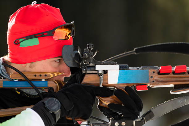 istock Close-up Shot of Young Male Biathlon Competitor Practicing Target Shooting 1094201966