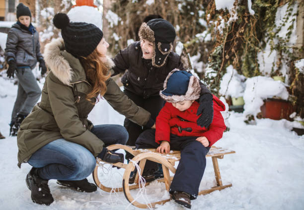 istock Mother with boys on a snow day 1094210516
