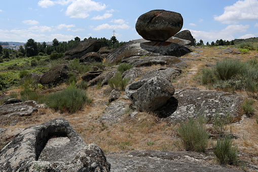 Panoramic view of some of the fifty-four sepultures, or burial sites, surrounding the mythical Bell Stone of the Necropolis site of St Gens near Celorico da Beira, Beira Alta, Portugal