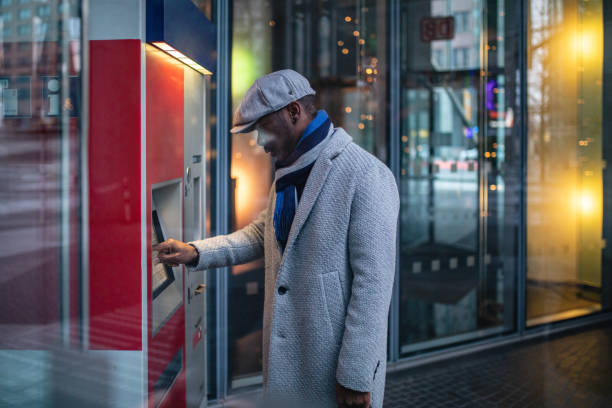 istock Businessman on a ATM machine in the city 1094215854