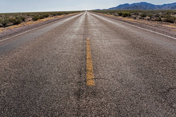 istock Long straight road into nowhere. 1094216076