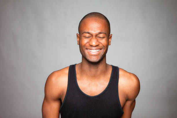 istock Haitian man  smiling with eyes closed on dark background 1094217230