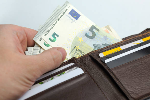 istock Hands holding a wad of money. 1094219148