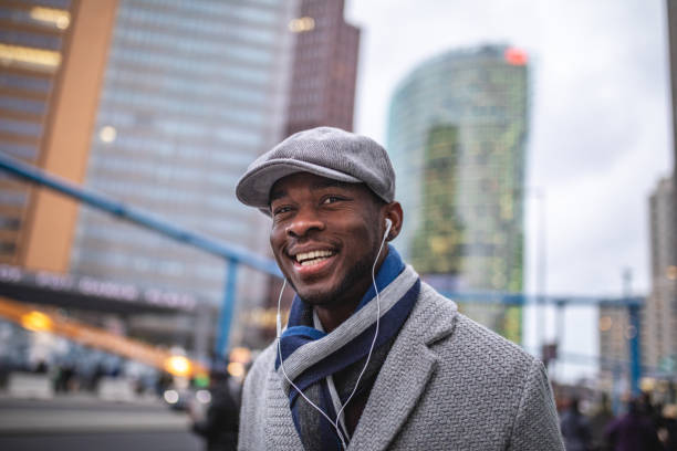 istock Cheerful manager listening to a podcast while going to work 1094219308