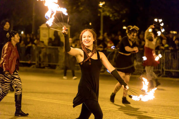 Chicago, Illinois, USA - October 21, 2017: The Arts in the Dark, The Halloween Parade, People wearing colorful Halloween outfits walking down Columbus Street.
