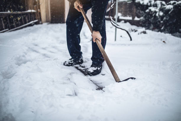 istock Senior man clening his back yard after a big snowfall 1094226068