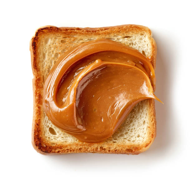 rebanada de pan tostado con caramelo derretido - milk bread fotografías e imágenes de stock