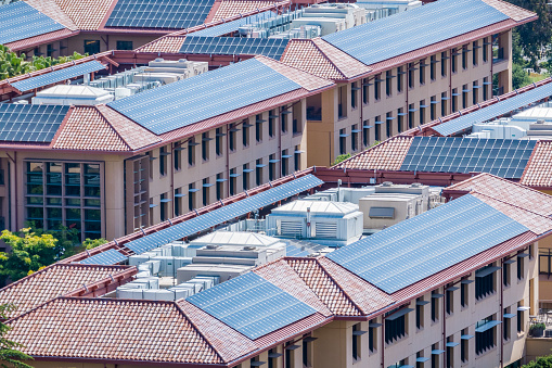 Solar panels installed on the tiled rooftops of buildings, San Francisco bay area, Silicon Valley, California