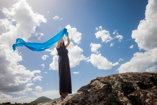istock woman meditating in nature 1094235494