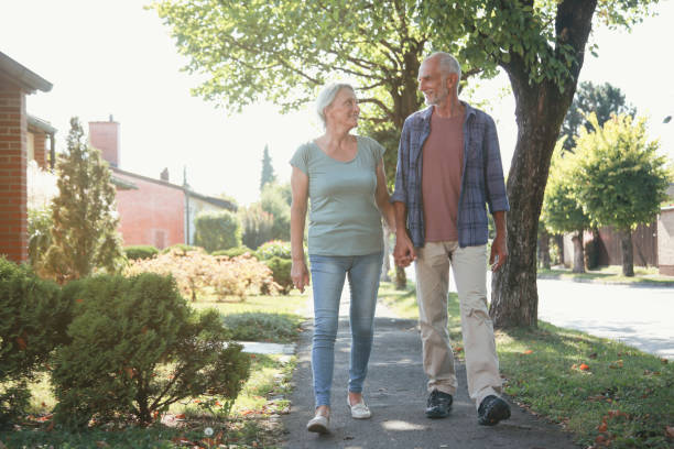 istock Senior couple walking on a sunny day 1094239296