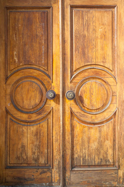 istock large solid wooden door with scuffs and cracks 1094240912