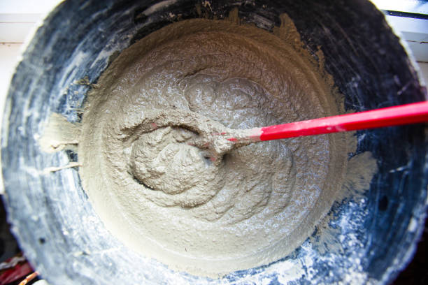 istock mixture of plaster in a bucket with a whisk 1094240976